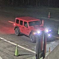 A crop of the red jeep