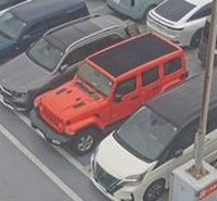 A crop of red suv 108
