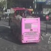 A crop of the pink double-decker bus