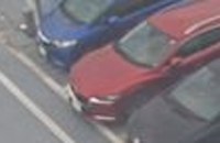 A crop of blue car K14