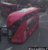 A blurred crop of the red double-decker bus