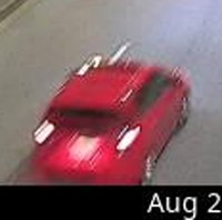 A crop of the red hatchback
